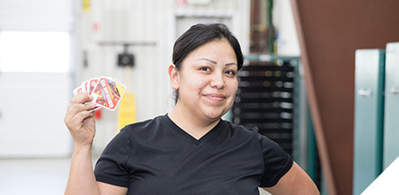 kwik lok employee holding labels